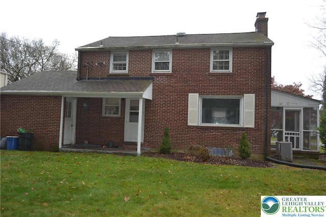 1424 Westgate Dr, Hanover Twp, PA 18017 - view of front of property featuring a chimney, brick siding, and a front yard