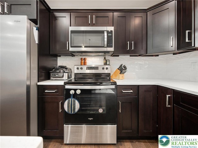 317 Fairview Ave, Wind Gap Boro, PA 18091 - kitchen featuring stainless steel appliances, light countertops, dark brown cabinets, and tasteful backsplash