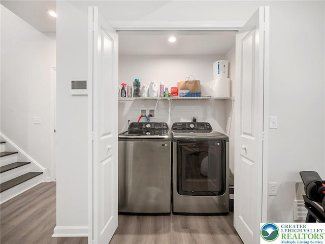 317 Fairview Ave, Wind Gap Boro, PA 18091 - washroom with washing machine and clothes dryer, wood finished floors, and recessed lighting