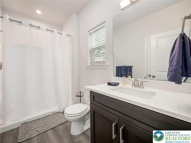 317 Fairview Ave, Wind Gap Boro, PA 18091 - full bath featuring wood finished floors, vanity, and a shower with shower curtain