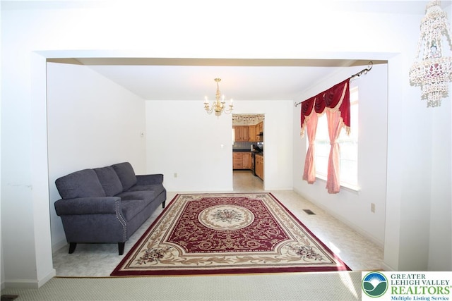 3814 Clay Dr, Lower Macungie Twp, PA 18062 - living area with a chandelier and baseboards