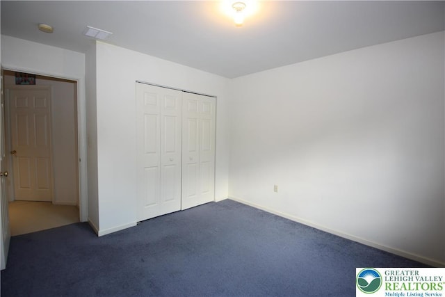3814 Clay Dr, Lower Macungie Twp, PA 18062 - unfurnished bedroom featuring dark carpet and a closet