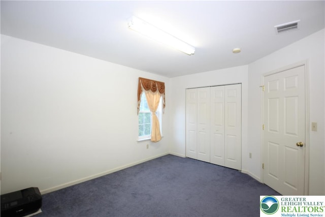 3814 Clay Dr, Lower Macungie Twp, PA 18062 - unfurnished bedroom with dark carpet and a closet
