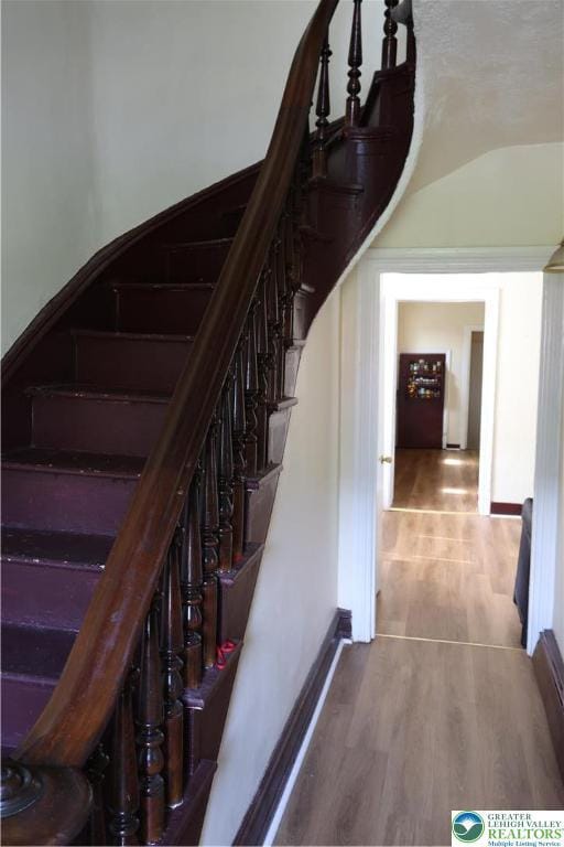 1533 E Emmaus, Salisbury Twp, PA 18103 - stairs featuring wood finished floors and vaulted ceiling