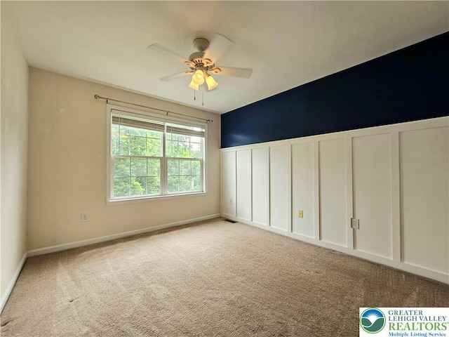 312 Maple Ct, Alburtis Boro, PA 18011 - carpeted spare room featuring a decorative wall, a ceiling fan, and wainscoting