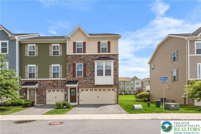 2324 Raya Way, Easton, PA 18045 - view of front of property featuring stone siding, driveway, and an attached garage