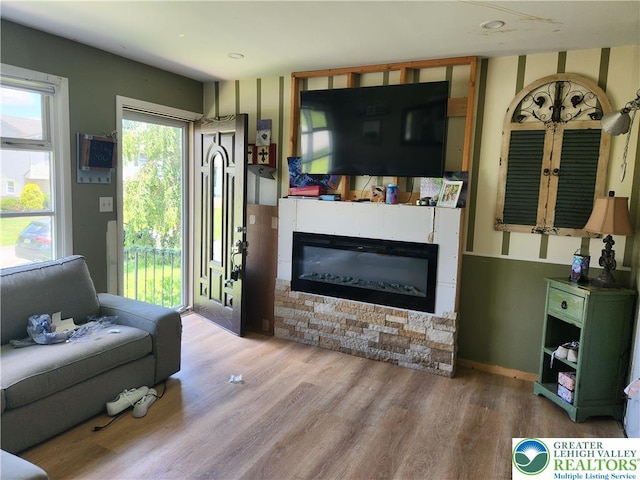 2840 Roosevelt St, Bethlehem Twp, PA 18020 - living room featuring wood finished floors, a glass covered fireplace, and recessed lighting