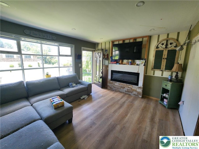 2840 Roosevelt St, Bethlehem Twp, PA 18020 - living room with wood finished floors, a glass covered fireplace, and recessed lighting