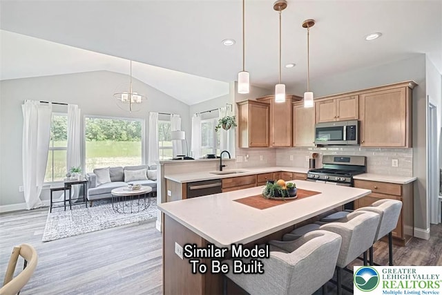 Bambi Ln Lot 40, Mahoning Twp, PA 18235 - kitchen with light wood-style floors, light countertops, appliances with stainless steel finishes, tasteful backsplash, and vaulted ceiling