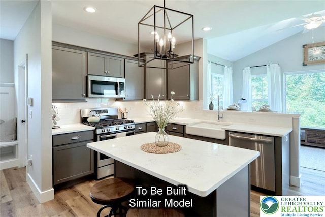 Bambi Ln Lot 40, Mahoning Twp, PA 18235 - kitchen with stainless steel appliances, gray cabinetry, a peninsula, light wood-style flooring, and lofted ceiling