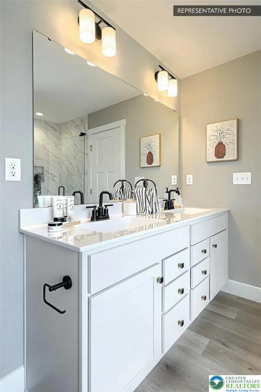 Bambi Ln Lot 40, Mahoning Twp, PA 18235 - bathroom with double vanity, a stall shower, and wood finished floors
