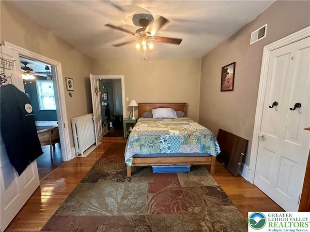 218 3rd, Lehighton Boro, PA 18235 - bedroom with radiator heating unit, wood finished floors, ceiling fan, and a baseboard radiator