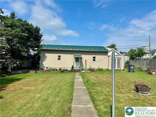 218 3rd, Lehighton Boro, PA 18235 - view of front of property featuring an outdoor fire pit, a metal roof, an outdoor structure, and entry steps