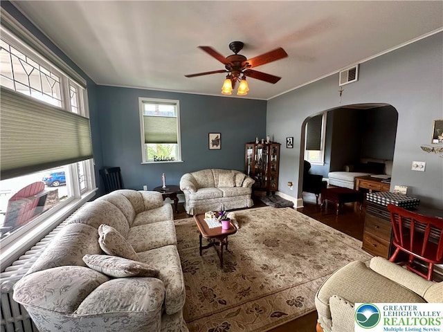 218 3rd, Lehighton Boro, PA 18235 - living area featuring arched walkways, ceiling fan, plenty of natural light, wood finished floors, and crown molding