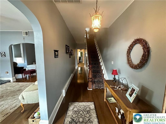 218 3rd, Lehighton Boro, PA 18235 - corridor with arched walkways, wood finished floors, stairway, a baseboard heating unit, and ornamental molding