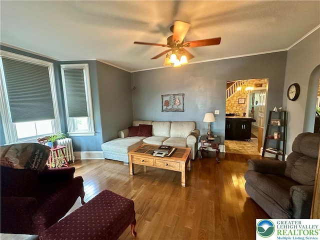 218 3rd, Lehighton Boro, PA 18235 - living area with wood finished floors, arched walkways, a ceiling fan, and ornamental molding