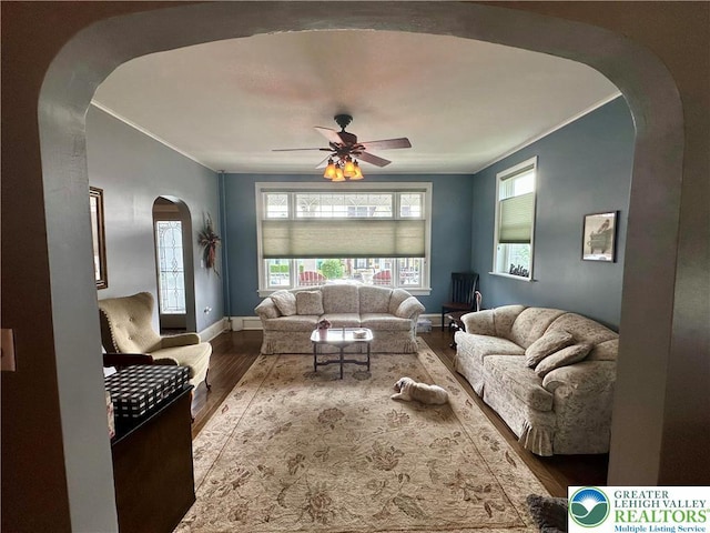 218 3rd, Lehighton Boro, PA 18235 - living room with arched walkways, wood finished floors, ceiling fan, and ornamental molding