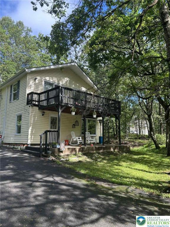 15 Hiawatha Trl, Penn Forest Twp, PA 18210 - view of front facade with driveway and a deck