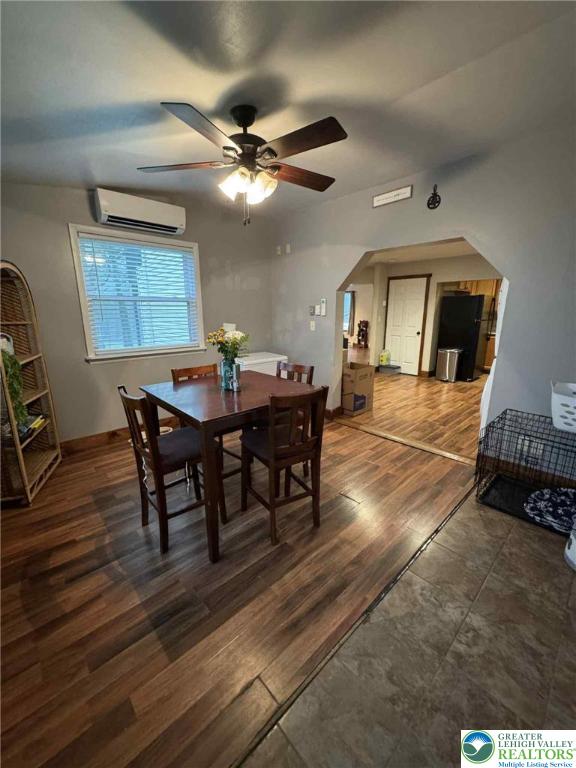 15 Hiawatha Trl, Penn Forest Twp, PA 18210 - dining area with ceiling fan, wood finished floors, and an AC wall unit