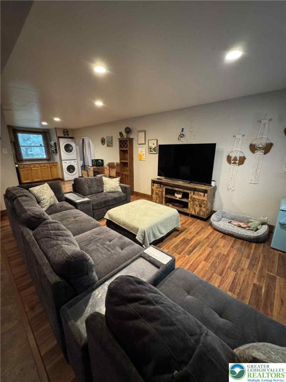 15 Hiawatha Trl, Penn Forest Twp, PA 18210 - living area with stacked washer and clothes dryer, wood finished floors, and recessed lighting
