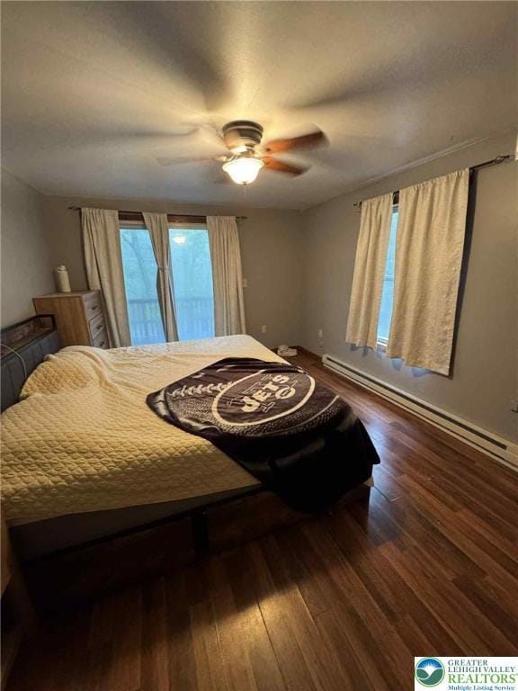 15 Hiawatha Trl, Penn Forest Twp, PA 18210 - bedroom with baseboard heating, wood finished floors, ceiling fan, and access to outside