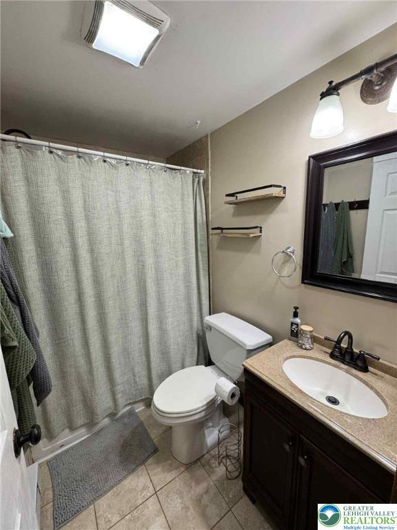 15 Hiawatha Trl, Penn Forest Twp, PA 18210 - bathroom with vanity, tile patterned floors, and a shower with curtain