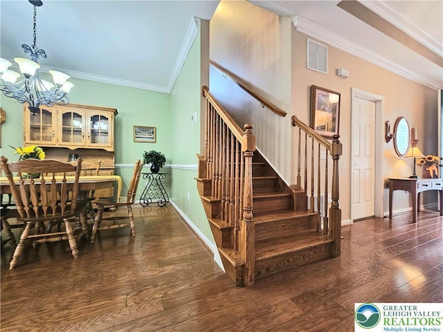 15 Devonshire Dr, Palmer Twp, PA 18045 - stairs with ornamental molding, a chandelier, and hardwood / wood-style floors