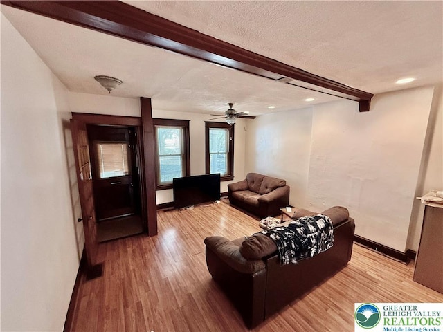 926 Delaware Ave, Fountain Hill Boro, PA 18015 - living area featuring beam ceiling, light wood-style flooring, a textured ceiling, and ceiling fan