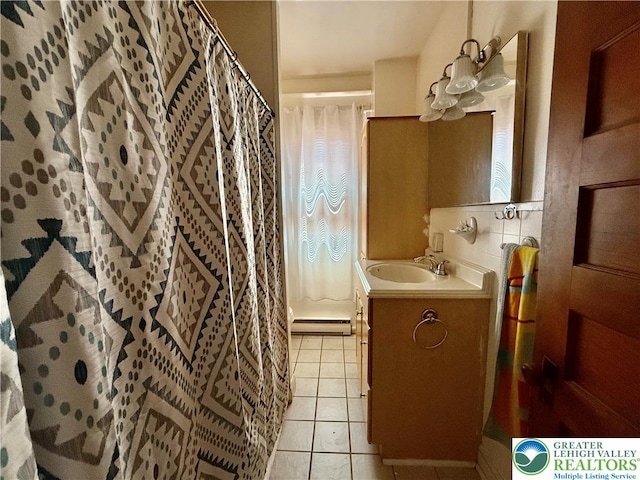 926 Delaware Ave, Fountain Hill Boro, PA 18015 - full bathroom featuring vanity, tile patterned floors, a baseboard heating unit, curtained shower, and a chandelier