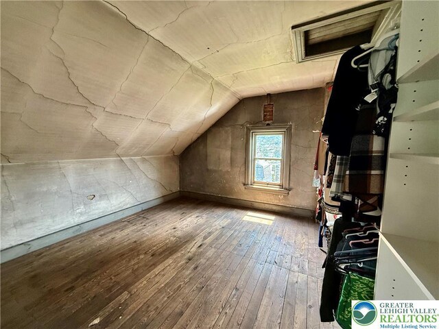 926 Delaware Ave, Fountain Hill Boro, PA 18015 - bonus room with hardwood / wood-style flooring, lofted ceiling, and attic access
