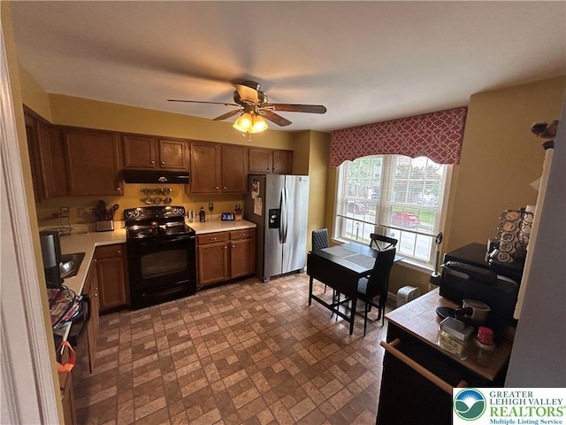 359 2nd, Alburtis Boro, PA 18011 - kitchen featuring black electric range oven, stainless steel refrigerator with ice dispenser, light countertops, ceiling fan, and under cabinet range hood