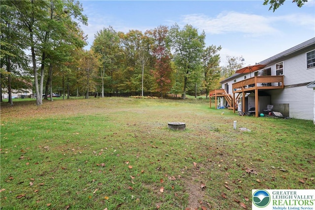 303 Lakefield Ter, Jackson Twp, PA 18360 - view of green lawn with a wooden deck and stairway