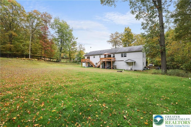 303 Lakefield Ter, Jackson Twp, PA 18360 - view of grassy yard with stairway and a wooden deck