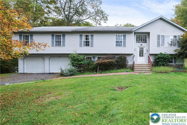 303 Lakefield Ter, Jackson Twp, PA 18360 - bi-level home with a garage, a front yard, and driveway