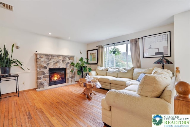 303 Lakefield Ter, Jackson Twp, PA 18360 - living room featuring hardwood / wood-style floors, a stone fireplace, and recessed lighting