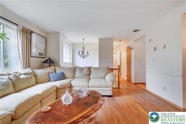 303 Lakefield Ter, Jackson Twp, PA 18360 - living area with a chandelier and light wood-style floors