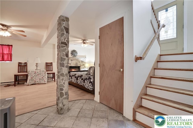 303 Lakefield Ter, Jackson Twp, PA 18360 - entrance foyer with a ceiling fan, stairway, and a stone fireplace