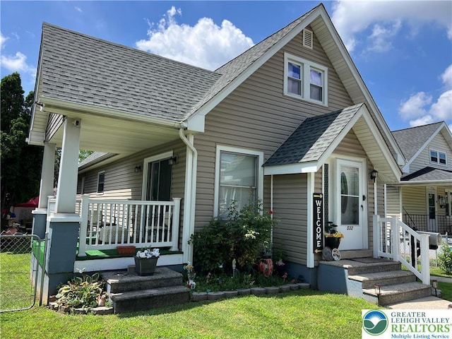 532 6th St, Whitehall Twp, PA 18052 - bungalow with a shingled roof, covered porch, and a front lawn