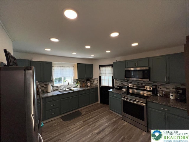 532 6th St, Whitehall Twp, PA 18052 - kitchen featuring stainless steel appliances, decorative backsplash, plenty of natural light, recessed lighting, and dark wood finished floors