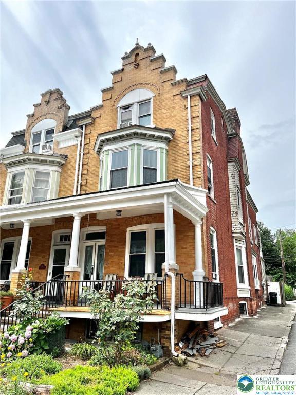 26 S 14th St, Allentown City, PA 18102 - view of front facade with a porch and brick siding