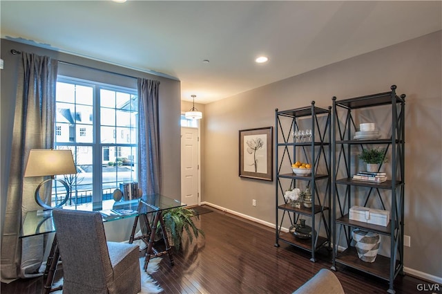 office space with dark wood-type flooring