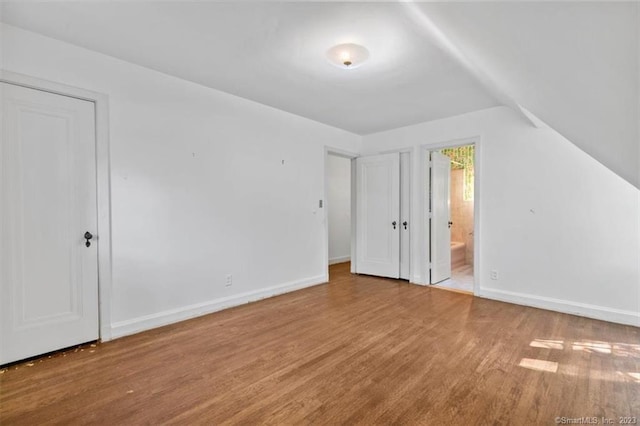 bonus room with light hardwood / wood-style flooring