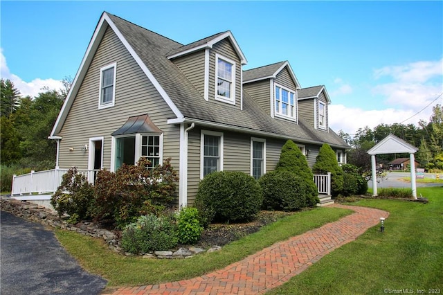 view of front of home featuring a front yard and a gazebo