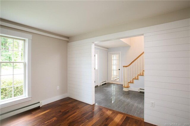 277 Ashley Falls Rd, North Canaan, CT 06018 - empty room with dark wood-type flooring and a baseboard heating unit