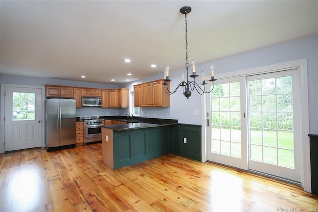 277 Ashley Falls Rd, North Canaan, CT 06018 - kitchen featuring decorative light fixtures, light wood-type flooring, stainless steel appliances, and kitchen peninsula
