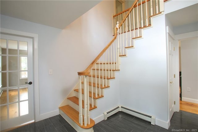277 Ashley Falls Rd, North Canaan, CT 06018 - staircase featuring baseboard heating and dark hardwood / wood-style flooring