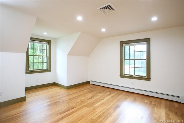 277 Ashley Falls Rd, North Canaan, CT 06018 - bonus room featuring vaulted ceiling, a baseboard radiator, and light wood-type flooring
