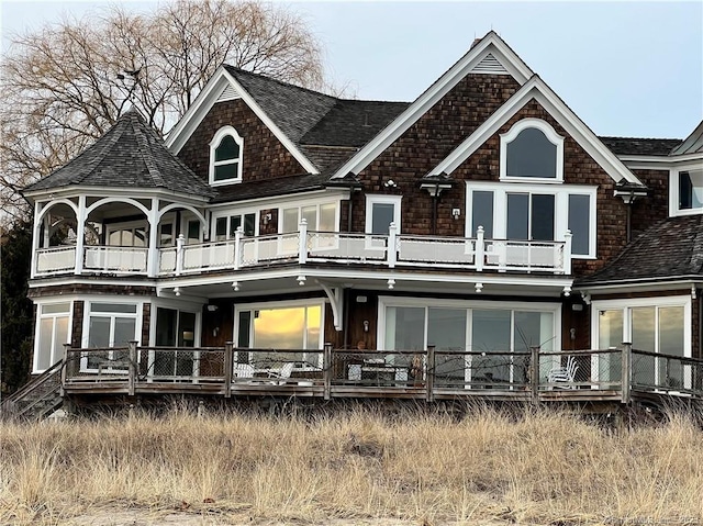 rear view of house with a balcony