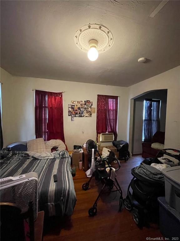 bedroom with wood-type flooring