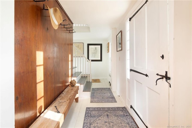 hallway featuring light tile flooring